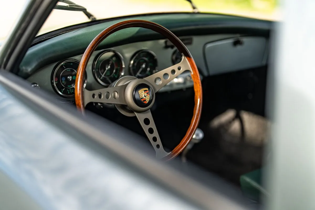 Modern VDO gauges behind the donated wheel
