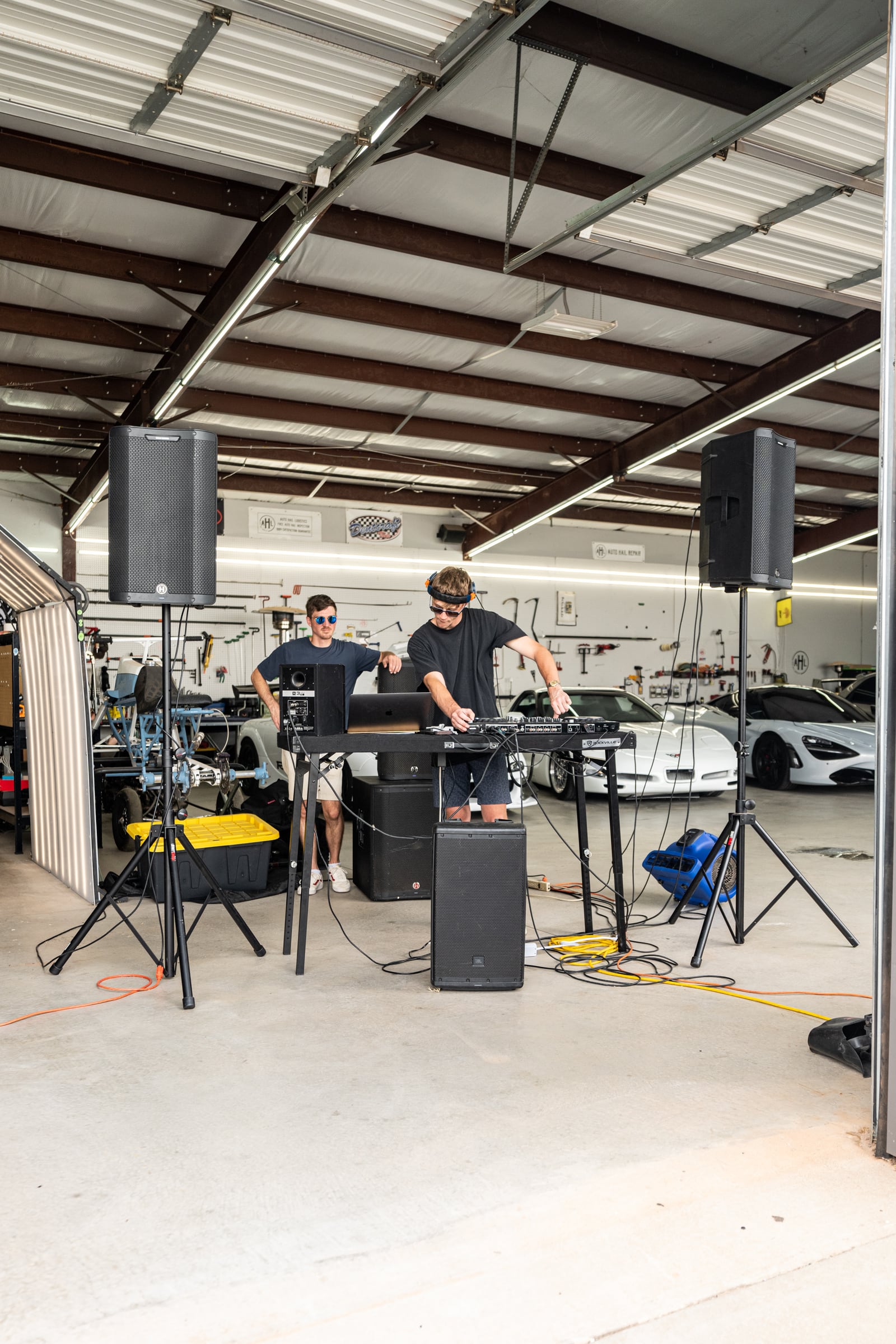 The cruise staging area with a sound setup and crew under a tent.